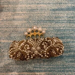 Alexander Mcqueen Four-ring Knuckle Studded clutch